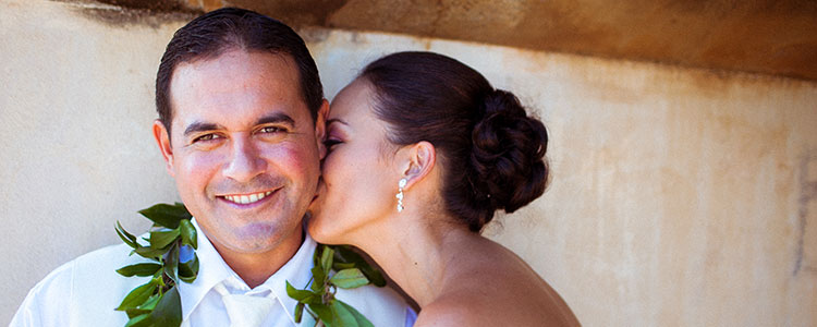 Bride and groom sharing a joyful wedding moment, symbolizing radiant skin preparation and bridal skincare planning for a special day